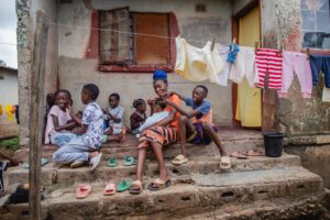 Zambian children surrounding a young Zambian mother.